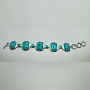 Blue Turquoise Rhodium Over Silver Bracelet. 7 inches not including clasp